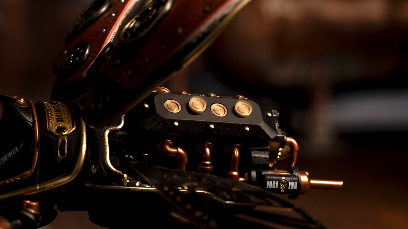 Close-up of a mechanical component with gold accents on a blurred background